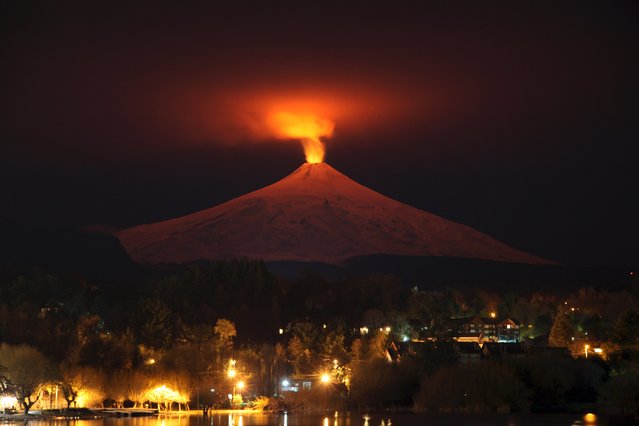 The Villarrica Volcano is seen at night from Pucon town, Chile, July 12, 2015. (Photo by Cristobal Saavedra/Reuters)