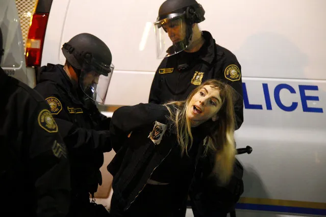 Police detain a demonstrator during a protest against the election of Republican Donald Trump as President of the United States in Portland, Oregon, U.S. November 10, 2016. (Photo by Steve Dipaola/Reuters)