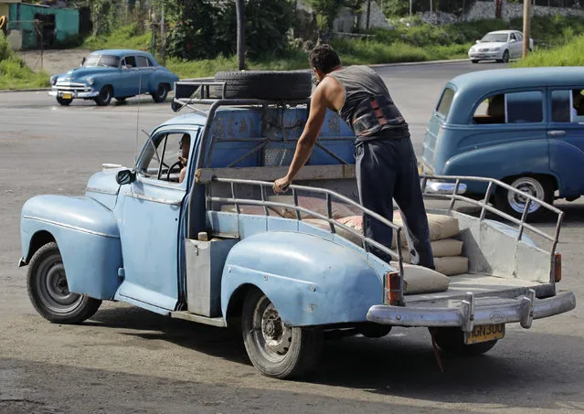A modified 1948 Ford Deluxe sedan with a load of cement sacks in Havana, July 2012. (Photo by Desmond Boylan/Reuters)