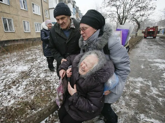 An elderly woman reacts after the residential block in which she lives in was damaged by a recent shelling, according to locals, on the outskirts of Donetsk, eastern Ukraine February 9, 2015. (Photo by Maxim Shemetov/Reuters)