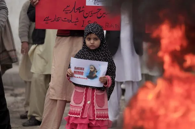 A girl holds a picture of Sheikh Nimr al-Nimr who was executed along with others in Saudi Arabia, during a protest against the execution organised by Imamia Student Organisation (ISO) in Peshawar, Pakistan, January 3, 2016. (Photo by Fayaz Aziz/Reuters)