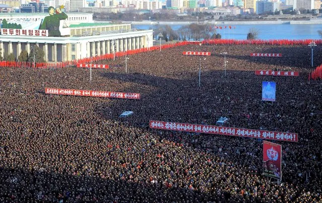 People take part in a mass rally at Kim Il Sung Square in Pyongyang to mark North Korean leader Kim Jong Un's New Year Address in this photo released by North Korea's Korean Central News Agency (KCNA) on January 5, 2016. (Photo by Reuters/KCNA)