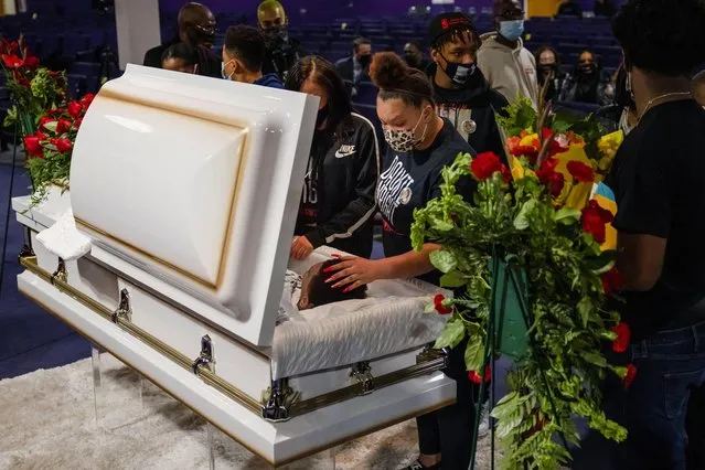 Mourners assemble in a church for the public viewing of Daunte Wright, a Black man who was fatally shot by a police officer after a routine traffic stop, in Minneapolis, Minnesota, U.S. April 21, 2021. (Photo by Carlos Barria/Reuters)