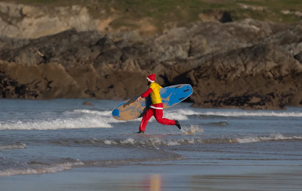 Surfing Santa's at Fistral Bay
