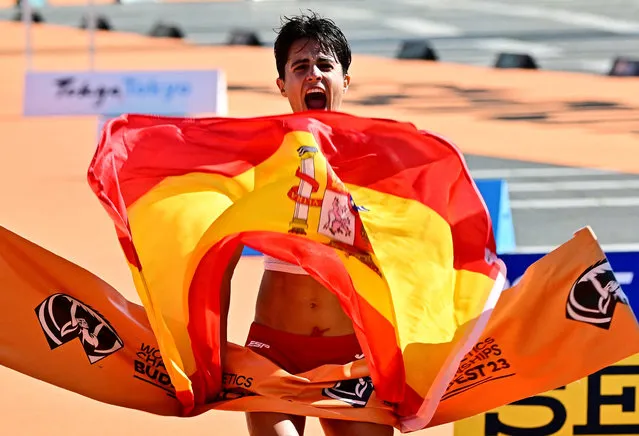 Spain's Maria Perez celebrates as she crosses the finish line to win the women's 35km race walk final during the World Athletics Championships in Budapest on August 24, 2023. (Photo by Marton Monus/Reuters)