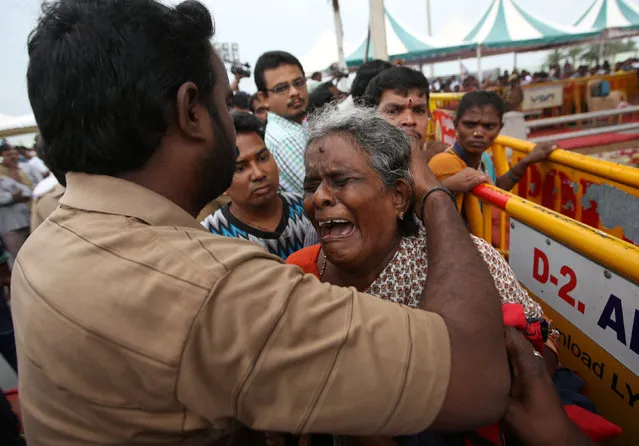 A supporter of Tamil Nadu Chief Minister Jayalalithaa Jayaraman cries after visiting the Jayalalithaa’s burial site in Chennai, India, December 7, 2016. (Photo by Adnan Abidi/Reuters)