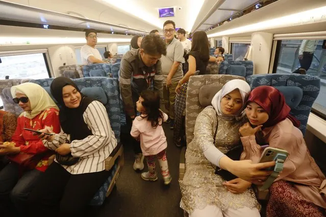 Indonesian passengers ride on the Jakarta-Bandung High-Speed Train in Jakarta, Indonesia on September 17, 2023. The Indonesian government has finally opened the opportunity for the general public to ride the Bandung High-Speed Train after a series of trial stages. (Photo by Adi Weda/EPA/EFE)