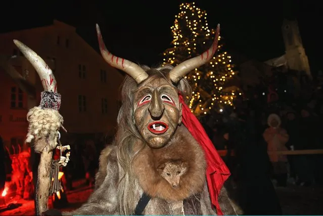 Locals dressed as “Perchten”, a traditional demonic creature in German and Austrian Alpine folklore, parade through the town center during the annual “Rauhnacht” gathering on January 5, 2017 in Waldkirchen, Germany. (Photo by Johannes Simon/Getty Images)