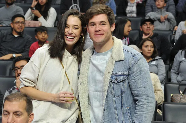 Actors Adam DeVine and Chloe Bridges attend a basketball game between the Los Angeles Clippers and the Sacramento Kings at Staples Center on December 26, 2018 in Los Angeles, California. (Photo by Allen Berezovsky/Getty Images)