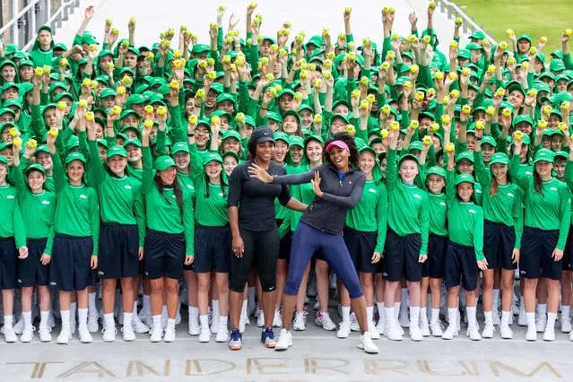 Tennis player Serena Williams (centre L) and her sister Venus (centre R) pose with Australia Open ballkids in Melbourne on January 10, 2017. Top players from around the world are arriving in Melbourne in the lead up to the Australian Open tennis tournament which will be held from 16-29 January. (Photo by Fiona Hamilton/AFP Photo)