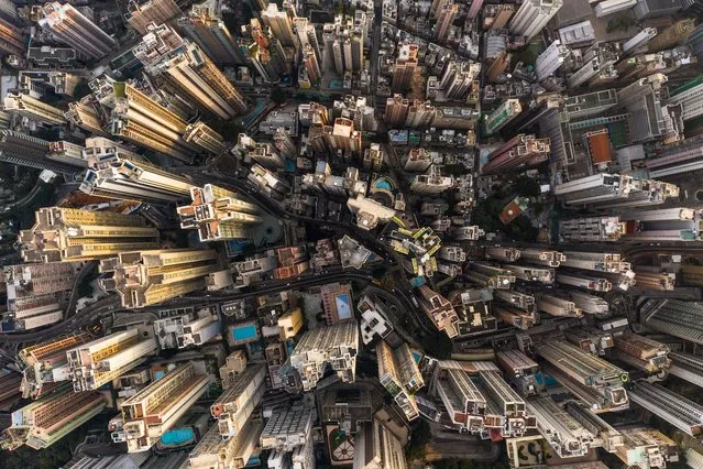 This aerial photo taken on December 28, 2018 shows commercial and residential buildings in Hong Kong. (Photo by Dale De La Rey/AFP Photo)