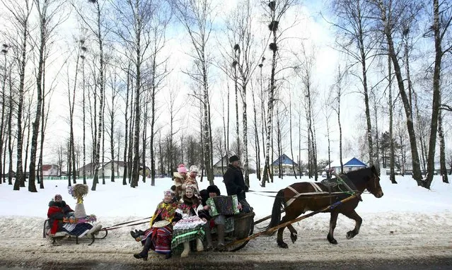 Local residents take part in the celebrations of Kolyada pagan holiday, which over the centuries has merged with Orthodox Christmas festivities and marks the upcoming end of winter, in the village of Noviny, Belarus, January 21, 2017. (Photo by Vasily Fedosenko/Reuters)
