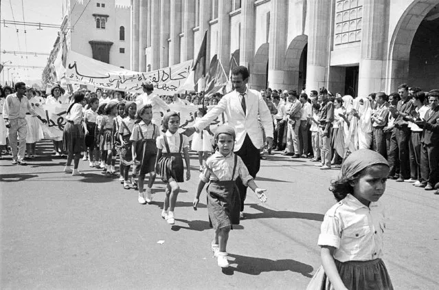 Children march in a parade during official independence celebrations in Algiers, Algeria, on July 5, 1962. Algeria is celebrating 60 years of independence from France on Tuesday July 5, 2022 with nationwide ceremonies, a pardon of 14,000 prisoners and its first military parade in years. Tuesday's events mark 60 years since the official declaration of independence on July 5, 1962, after a brutal seven-year war which ended 132 years of colonial rule. The war, which killed at least 1.5 million people, remains a point of tension in relations between Algeria and France. (Photo by AP Photo/File)