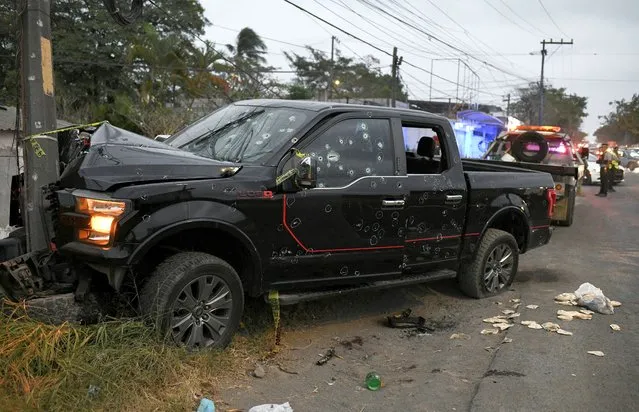 A view shows a vehicle riddled with bullet holes on a road where according to local media at least six people, including two minors, died during an armed attack, in Veracruz, Mexico on January 22, 2023. (Photo by Yahir Ceballos/Reuters)