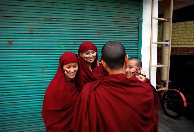 Tibetan nuns wait for the protest march to start, held to mark the 65th anniversary of the Tibetan uprising against Chinese rule, in the northern hill town of Dharamsala, India, on March 10, 2024. (Photo by Adnan Abidi/Reuters)
