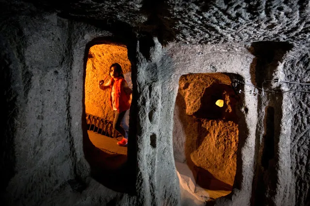 A young girl runs through a section of an underground city on April 17, 2016 in Nevsehir, Turkey. (Photo by Chris McGrath/Getty Images)