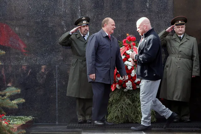Gennady Zyuganov (L), leader of the Russian Communist Party, and Russian American heavyweight mixed martial artist Jeff Monson attend a flower-laying ceremony to Soviet state founder Vladimir Lenin's mausoleum marking his birthday in Moscow's Red Square, Russia, April 22, 2016. (Photo by Maxim Zmeyev/Reuters)