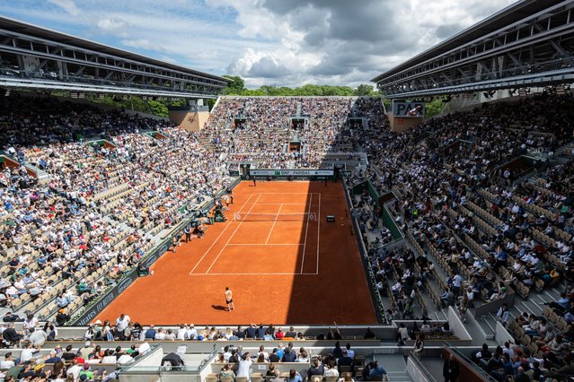 This photograph shows a view of Court Suzanne-Lenglen as France's Ugo Humbert and Italy's Lorenzo Sonego play their men's singles match on day one of The French Open tennis tournament at The Roland Garros Complex in Paris on May 26, 2024. (Photo by Bertrand Guay/AFP Photo)