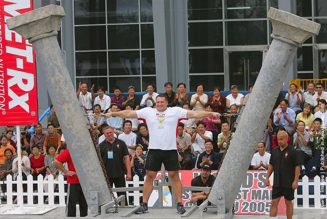 Jessen Paulin of Canada tries to pull two poles during a match of the 2005 World's Strongest Man Competition
