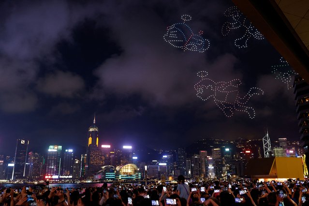Approximately 1,000 drones illuminate the sky above Victoria Harbour during the world's first Doraemon drone show in Hong Kong, China on May 25, 2024. (Photo by Tyrone Siu/Reuters)
