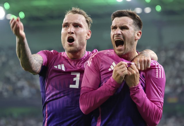 Pascal Gross of Germany (R) celebrates with teammates after scoring the 2-1 lead during the international friendly soccer match between Germany and Greece in Moenchengladbach, Germany, 07 June 2024. (Photo by Christopher Neundorf/EPA)
