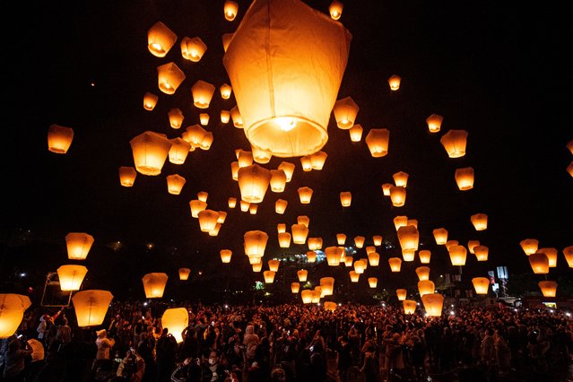 People release sky lanterns during the celebration of the Sky Lantern Festival, in Pingxi, New Taipei City, Taiwan, 05 February 2023. Local Taiwanese and foreign tourists released thousand of lanterns into the sky to wish for peace and happiness. (Photo by Ritchie B. Tongo/EPA)