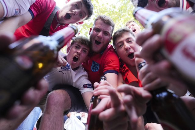 English soccer fans gather prior to a Group C match between England and Slovenia at the Euro 2024 soccer tournament in Cologne, Germany, Tuesday, June 25, 2024. (Photo by Markus Schreiber/AP Photo)