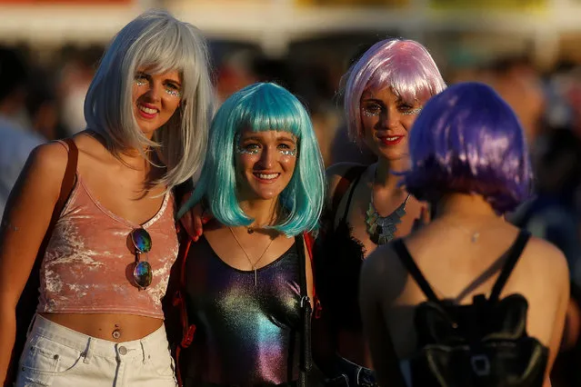 Women pose for a photo during the Coachella Valley Music and Arts Festival on April 16, 2017 in Indio, California. (Photo by Carlo Allegri/Reuters)