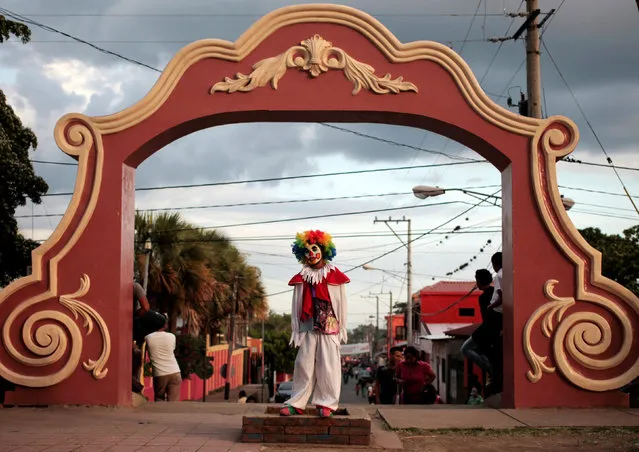 A reveller dressed as a clown poses for pictures during celebration of Virgen de los Desamparados, or Our Lady of the Abandoned, at Diria town, Nicaragua May 14, 2016. (Photo by Oswaldo Rivas/Reuters)