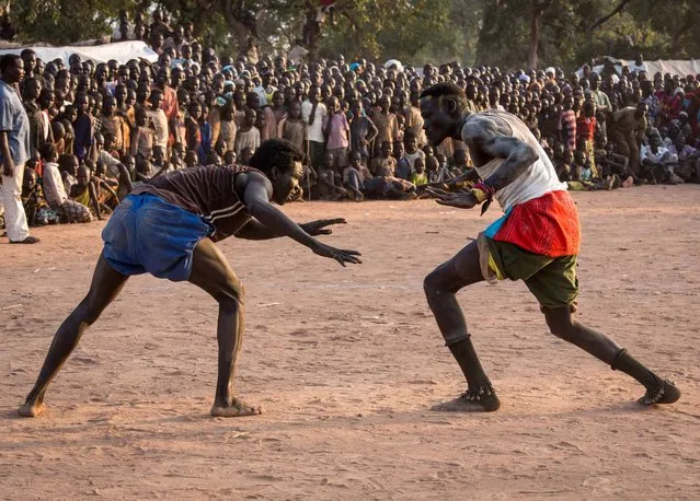 Refugees from South Kordofan celebrate the Eid al-Adha with a wrestling competition at the Yida camp in South Sudan. (Photo by Camille Lepage/AFP Photo)