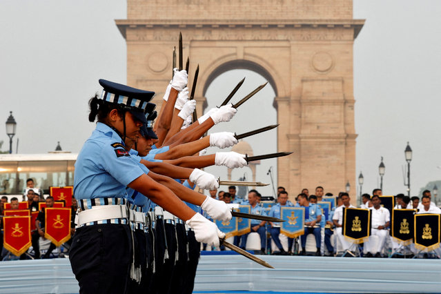 Members of Agniveervayu, the Indian Air Force's first-ever all-women drill team, perform in front of India Gate war memorial in New Delhi, India, on July 26, 2024. (Photo by Priyanshu Singh/Reuters)