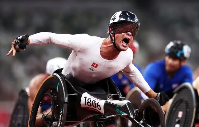 Marcel Hug of Team Switzerland celebrates after winning gold in the Men’s 5000m - T54 Final on day 4 of the Tokyo 2020 Paralympic Games at Olympic Stadium on August 28, 2021 in Tokyo, Japan. (Photo by Lisi Niesner/Reuters)