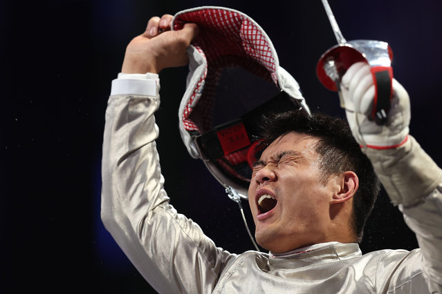 Yanke Feng of Team China celebrates after beating Jie Zhang of Team China during Men's Sabre Category B Semifinal on day six of the Paris 2024 Summer Paralympic Games at Grand Palais on September 03, 2024 in Paris, France. (Photo by Steph Chambers/Getty Images)