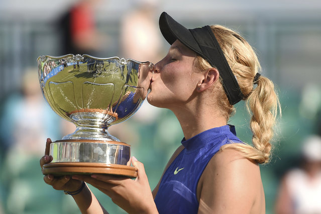 Croatia's Donna Vekic kisses the trophy after winning the women's final on day seven of the Nottingham Open at Nottingham Tennis Centre, England, Sunday June 18, 2017.  Vekic, defeated Britain's Johanna Konta 2-6, 7-6 (3), 7-5. (Photo by Joe Giddens/PA Wire via AP Photo)
