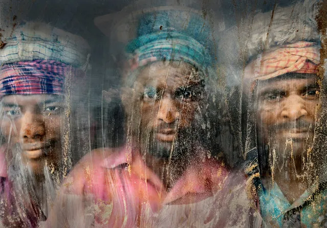 Second Place: Gravel Workmen. Gravel crush working place remains full of dust and sand. Three gravel workmen are looking through the window glass at their working place. Chittagong, Bangladesh. (Photo and caption by Faisal Azim/National Geographic Traveler Photo Contest)