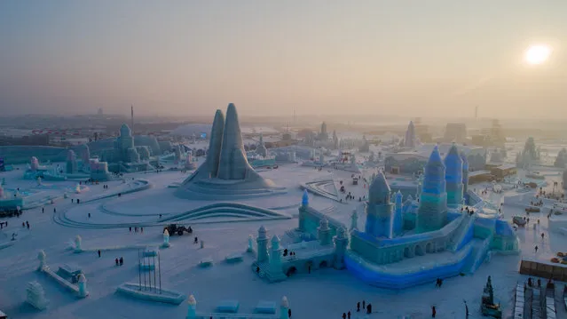 Aerial photo taken on December 23, 2019 shows a view of the 21st Ice-Snow World in Harbin, capital of northeast China's Heilongjiang Province. (Photo by Costfoto/Barcroft Media)