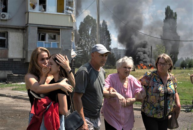 Locals react at the scene of a rocket attack on the Pervomaiskyi settlement of the Kharkiv area, eastern Ukraine, 04 July 2023 amid the Russian invasion. At least 31 people were injured, including nine children, according to the State Emergency Service. Russian troops entered Ukrainian territory in February 2022, starting a conflict that has provoked destruction and a humanitarian crisis. (Photo by George Ivanchenko/EPA/EFE/Rex Features/Shutterstock)