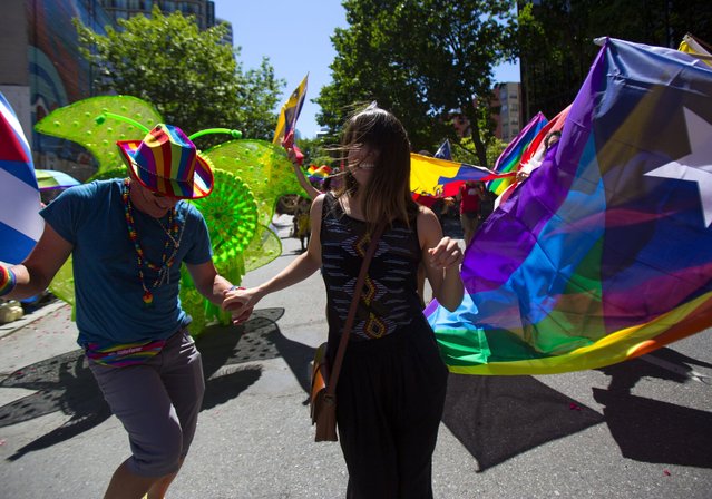 Diana Paredes dances in the Entre Hermanos group during the annual Pride parade in Seattle, Washington, Sunday, June 26, 2016. (Photo by Sy Bean/The Seattle Times)