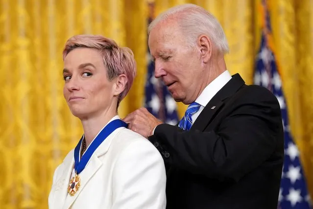 U.S. President Joe Biden awards the Presidential Medal of Freedom to U.S. Women's National Soccer Team player soccer player Megan Rapinoe during a ceremony at the White House in Washington, U.S., July 7, 2022. (Photo by Kevin Lamarque/Reuters)
