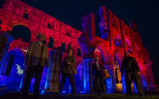 A light display illuminates the ruins of the historic Whitby Abbey on October 24, 2017 in Whitby, England. The famous Benedictine abbey was the inspiration for Bram Stoker's gothic novel Dracula and will be illuminated during the English Heritage event over seven nights during Halloween and the Half Term period to celebrate that history. (Photo by Charlotte Graham/The Telegraph)