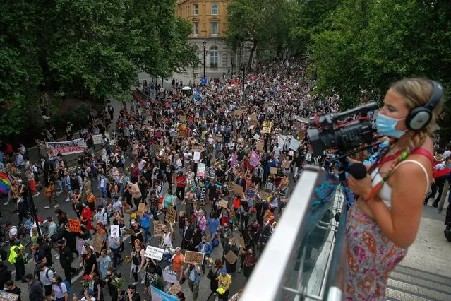 The Black Trans Lives Matter demonstrators hold placards as they march along Northumberland Ave on June 27, 2020 in London, England. The Black Trans Lives Matter march was held to support and celebrate the Black transgender community and to protest against potential amendments to the gender recognition act. (Photo by Hollie Adams/Getty Images)