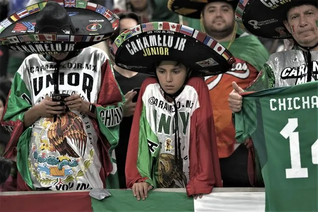 Mexico supporters react after the World Cup group C soccer match between Saudi Arabia and Mexico, at the Lusail Stadium in Lusail, Qatar, Thursday, December 1, 2022. (Photo by Moises Castillo/AP Photo)