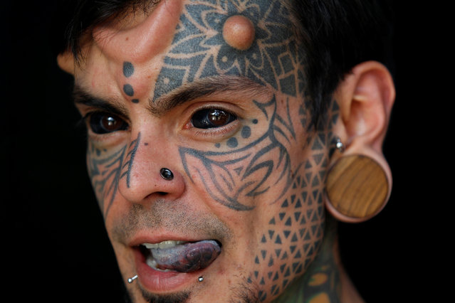 Carlos Dehaquiz poses for a photograph during the Expo Tattoo Fair in Medellin, Colombia July 14, 2017. (Photo by Fredy Builes/Reuters)
