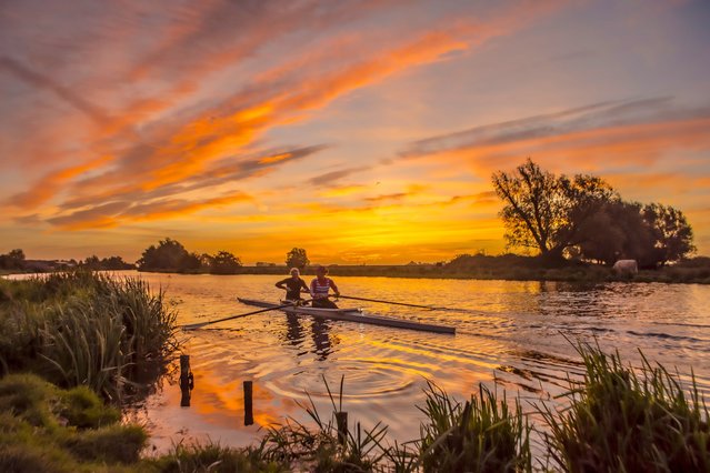 The picture dated October 7, 2022 shows the sun rise over the River Great Ouse in Ely, Cambridgeshire. (Photo by Veronica Johansson Poultney/Bav Media)