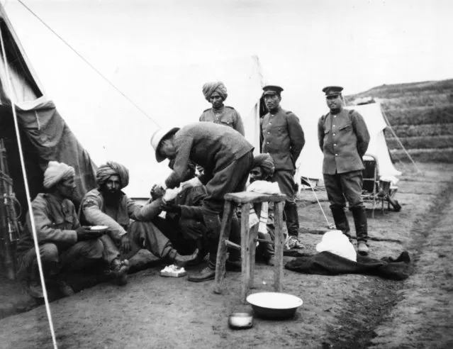 A medical orderly treating the sick and wounded during the siege of Tsingtao in the First World War, 1914. (Photo by Hulton Archive/Getty Images)