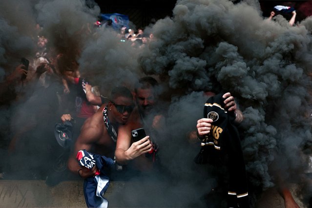 Paris Saint-Germain supporters celebrate their team's second goal as they watch the UEFA Champions League final football match between Paris Saint-Germain (PSG) and Inter Milan held in Munich on a large screen, at Parc des Princes Stadium in Paris on May 31, 2025. (Photo by Thibaud Moritz/AFP Photo)