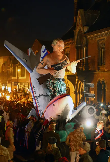 An effigy portraying Russian President Vladimir Putin is paraded through the town of Lewes, England, where an annual bonfire night procession is held by the Lewes Bonfire Societies, Wednesday November 5, 2014. (Photo by Gareth Fuller/AP Photo/PA Wire)