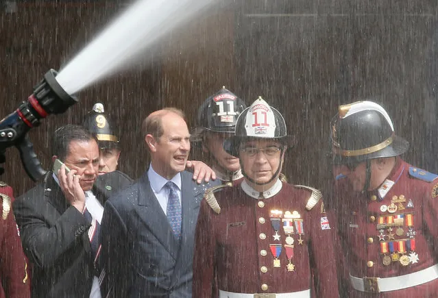 Britain's Prince Edward, Earl of Wessex (2nd L), watches a firefighting drill at the George Garland firehouse during an official visit to Valparaiso, Chile,  September 15, 2016. (Photo by Rodrigo Garrido/Reuters)