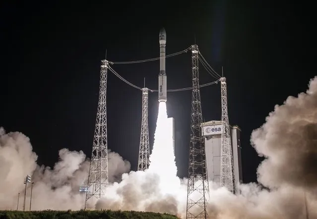 A handout picture released by the CNES (Centre national d'etudes spatiales – National Centre for Space Studies) and taken on June 15, 2016 in Kourou, French Guiana, shows the launching of the Vega rocket from the European Spaceport. The rocket successfully launched a multi-payload of satellites for Earth observation. Incliding the PeruSAT-1, Peru's first Earth observation satellite, and Skysat 4,5,6 and 7 micro-satellites for the Terra Bella (a Google company) project. (Photo by AFP Photo/CNES)