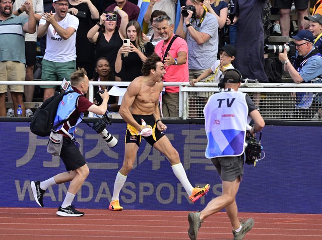 Armand Duplantis (C) of Sweden celebrates after setting a new world record in the men's pole vault competition at the World Athletics Diamond League meeting in Stockholm, Sweden, 15 June 2025. (Photo by Jonas Ekstromer/EPA/EFE)